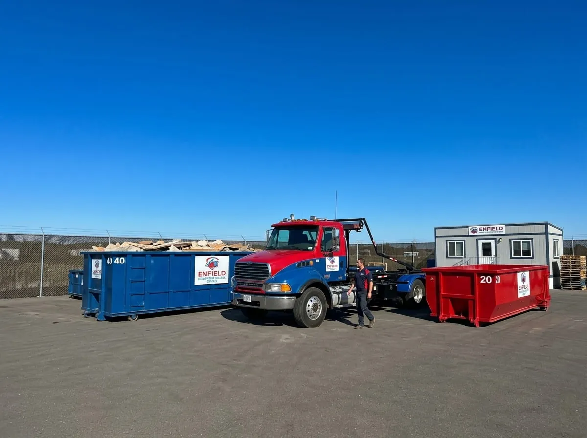 Enfield Dumpster Rental Group roll-off truck fleet parked at the Enfield yard